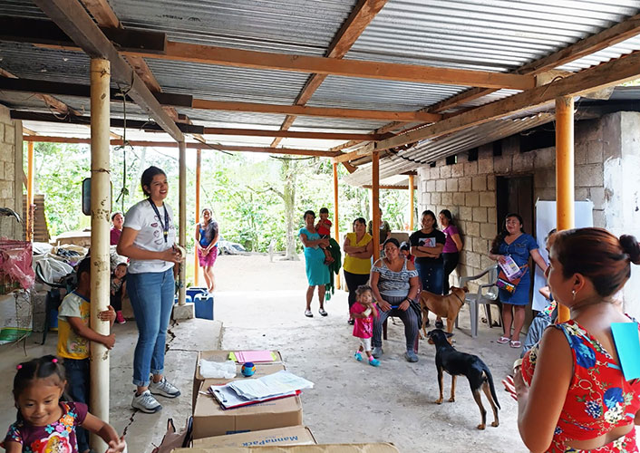 A group of people gathered in a conversation.