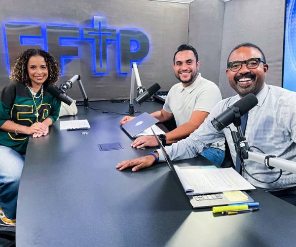 Daniel Patiño sits with his co-host and guest Blanca in FFTP radio studio