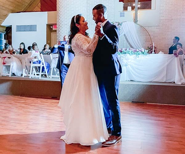 Maricarmen and her husband Paul dancing at their wedding