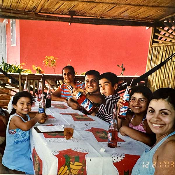 Andrea Delgado eating dinner with family